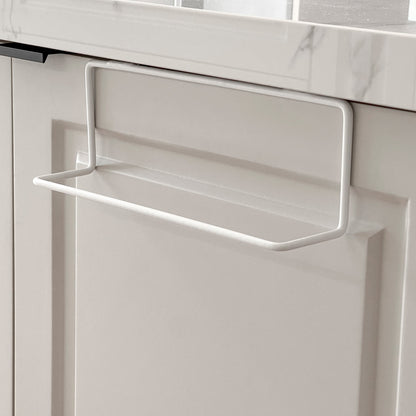 Colgador de secadores en color blanco, instalado en una puerta