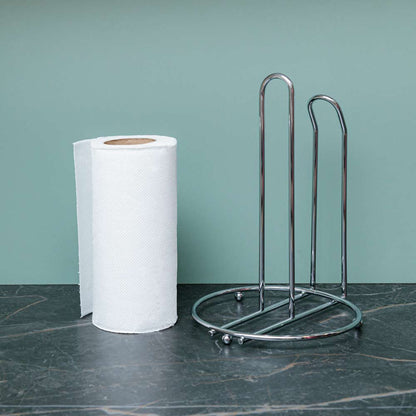 Porta papel toalla vacío junto a un rollo de papel